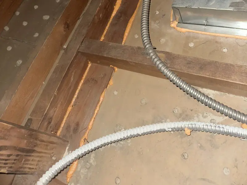 Attic cleared down to the drywall with penetrations sealed