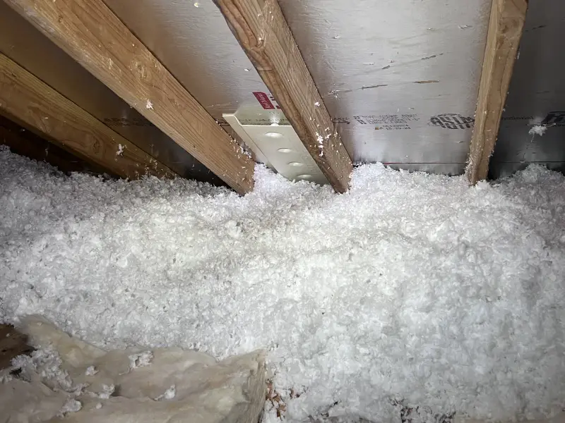 Loose blown-in insulation in an attic