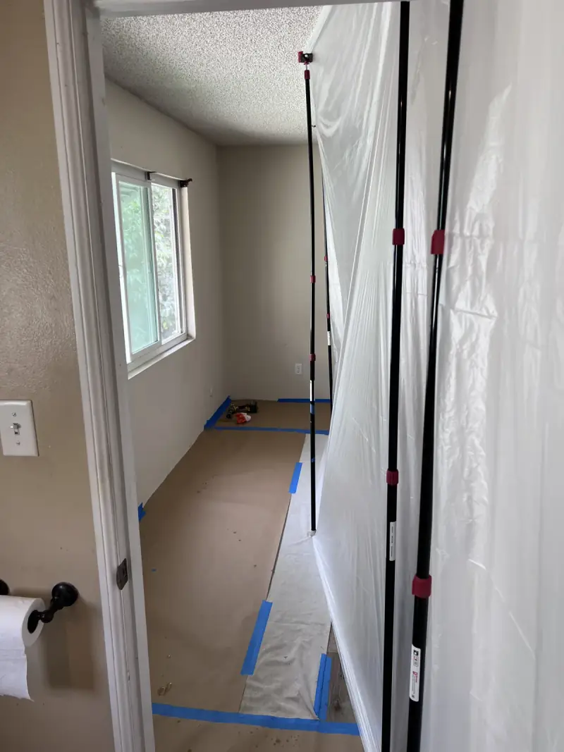 Plastic dust barriers protecting a room